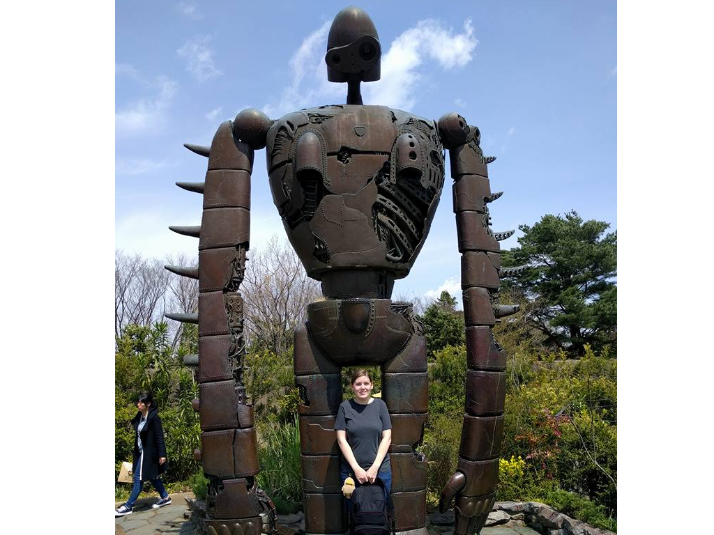 Me posing in front of a giant robot statue