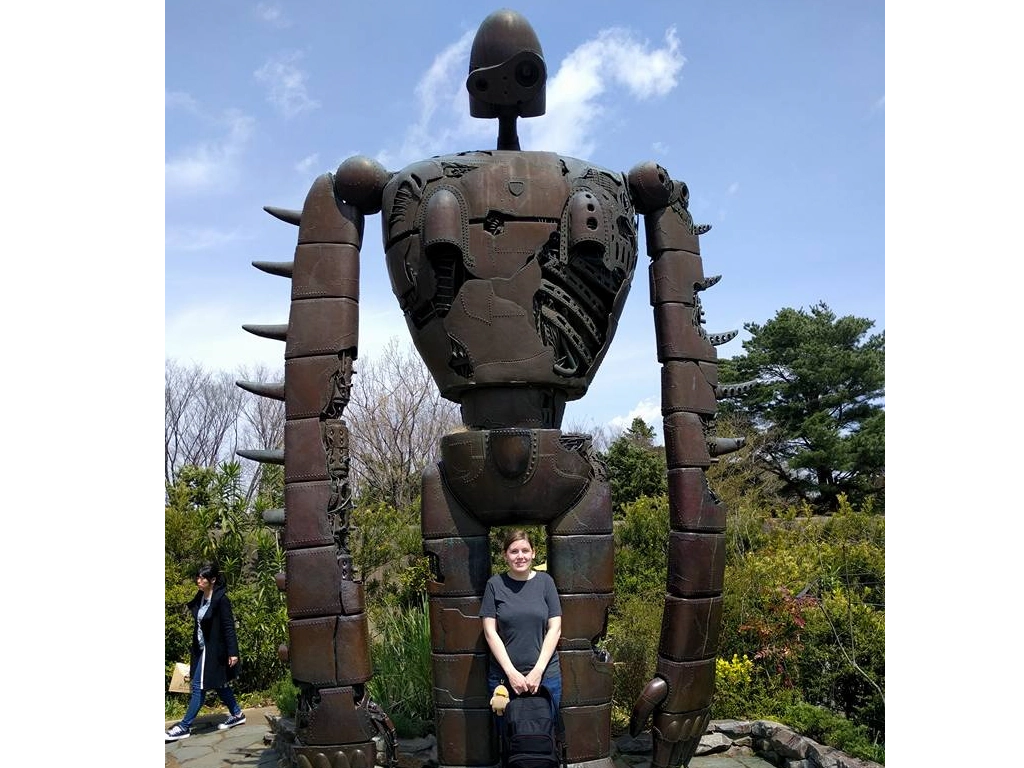 Me posing in front of a giant robot statue