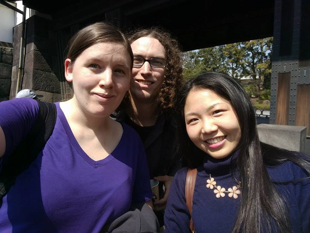 Me with my boyfriend and a friend in front of a gate