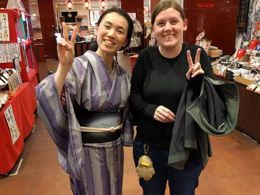 Japanese woman in a kimono posing with me
